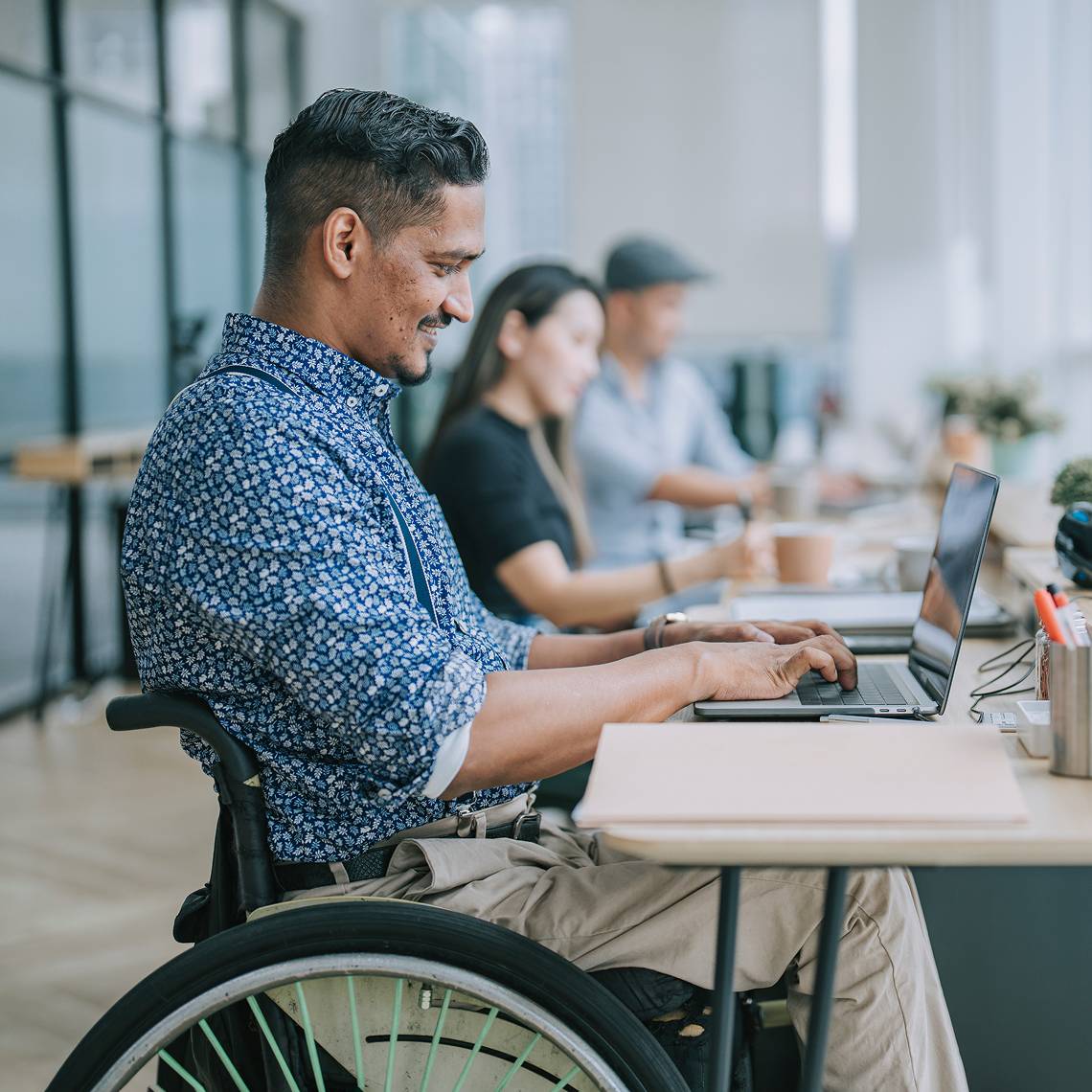 Developer working on a laptop for the SafeSend developer portal