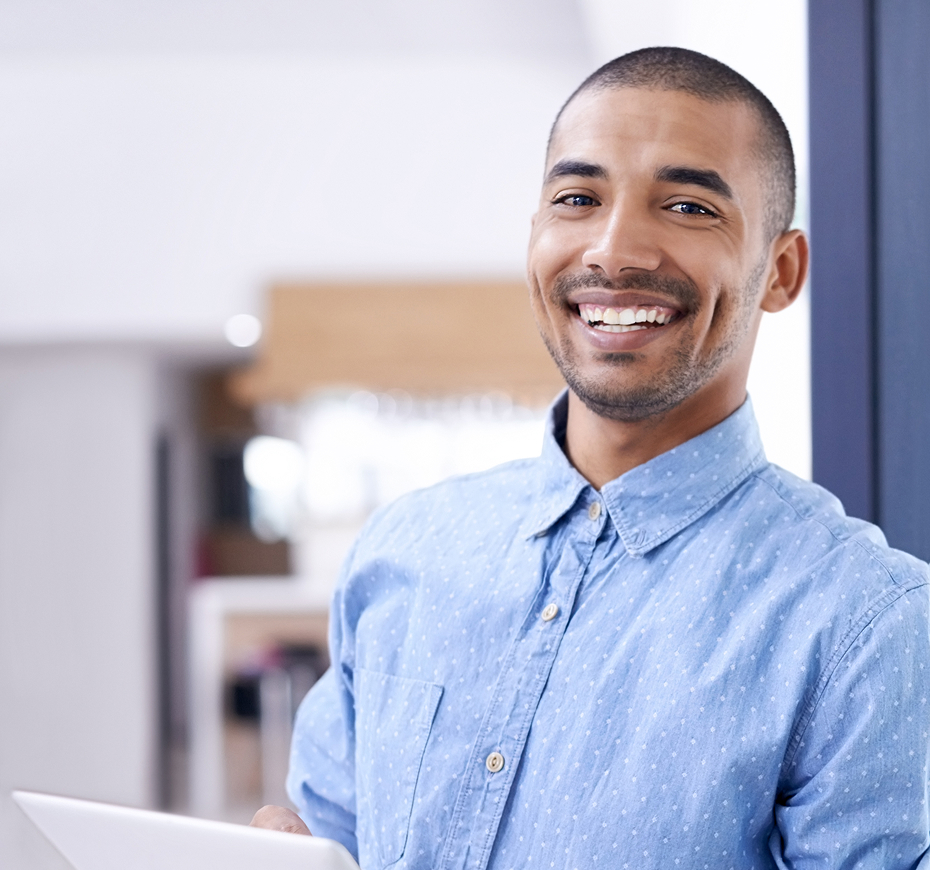 Smiling professional in a modern office, representing successful SafeSend clients